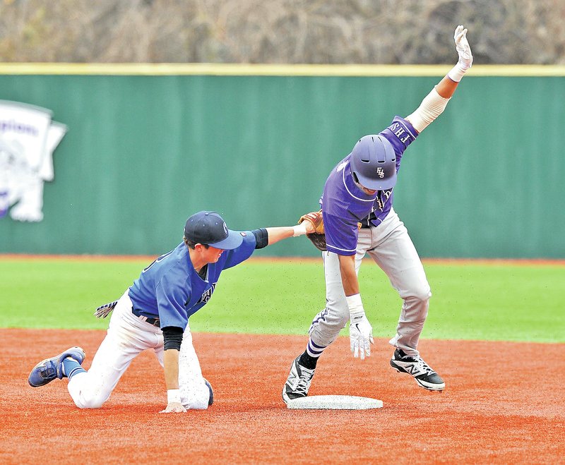  Staff Photo Michael Woods @NWAMICHAELW Adam Winter, Conway second baseman, tries to tag Fayetteville baserunner Kyle Pate as he steals second base in Saturday&#8217;s game at Fayetteville.