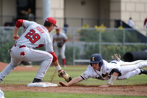 Arkansas first baseman Eric Fisher attempts to tag out a Cal base runner Sunday at the Cal Baseball Classic in Berkeley, Calif. The Razorbacks lost both games of the doubleheader.
