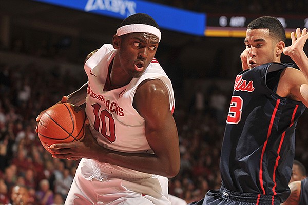 Arkansas forward Bobby Portis pulls in a rebound in front of an Ole Miss defender during a game Wednesday, March 5, 2014 at Bud Walton Arena in Fayetteville.