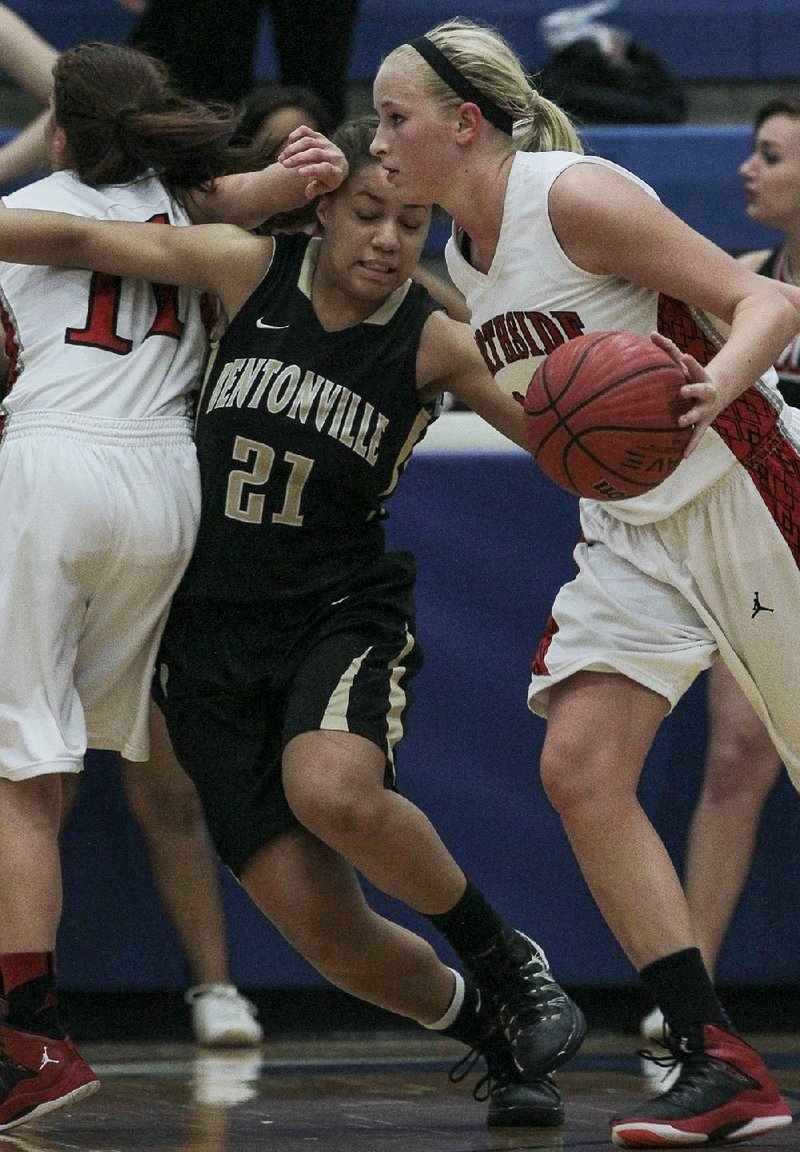 Arkansas Democrat-Gazette/BENJAMIN KRAIN --3/10/2014--
Ft Smith Northside's Olivia Hanson dribbles around Bentonville defender Peyton Taylor who get tangled up with Lauren Hargus Monday in Conway. Ft Smith advances to the 7A state championship game in Hot Springs this weekend.