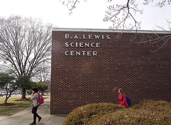 Arkansas Democrat-Gazette/MELISSA SUE GERRITS 
Students pass the Lewis Science Center on the University of Central Arkansas’ campus in Conway on Friday. The building is scheduled for renovations.