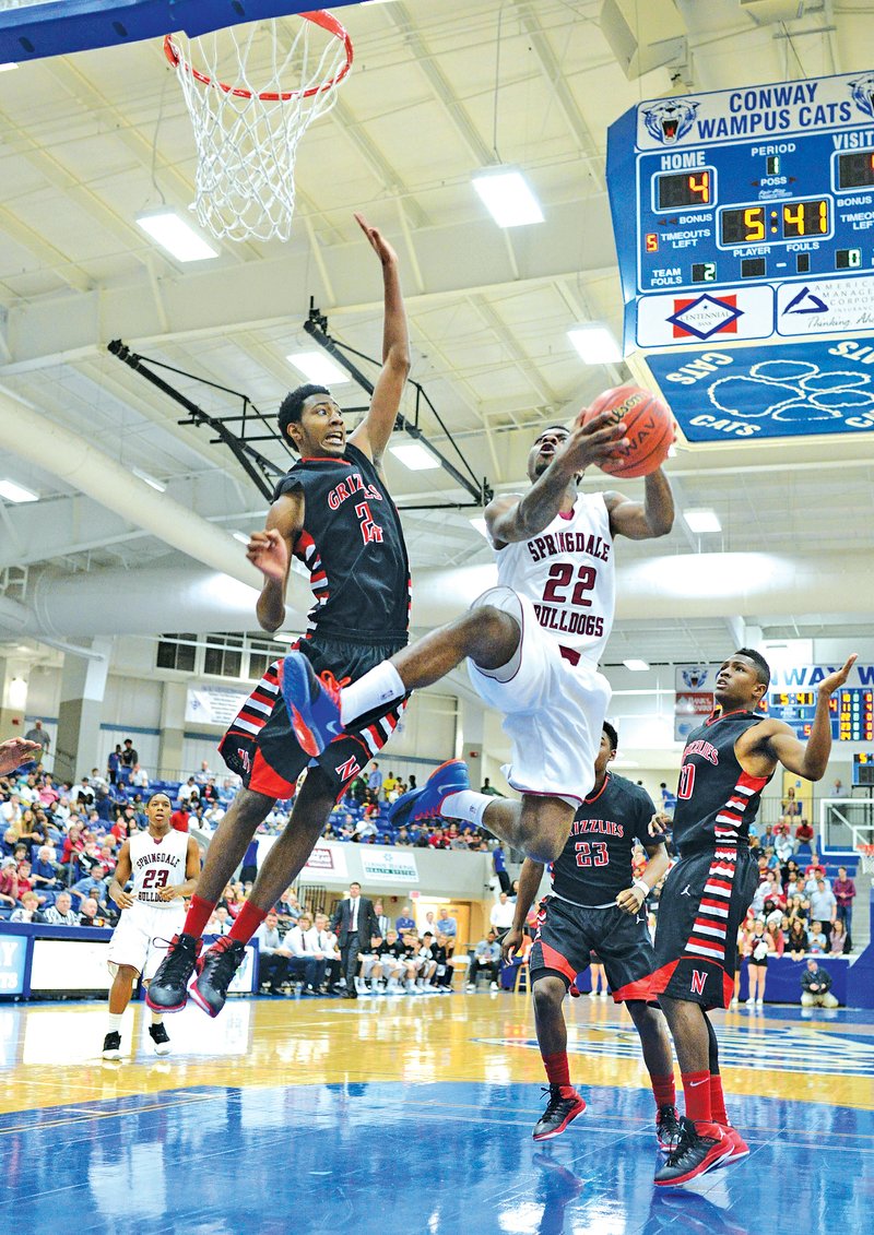 Special to NWA MEDIA Jaison Sterling D.J. Evans of Springdale High soars to the basket Monday against Fort Smith Northside at the Class 7A state tournament in Conway.