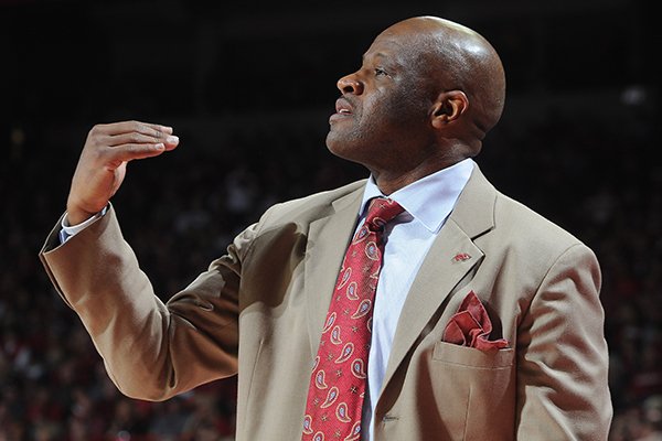 Arkansas' Mike Anderson coaches from the bench Saturday, March 1, 2014, during the second half of the game at Bud Walton Arena in Fayetteville
