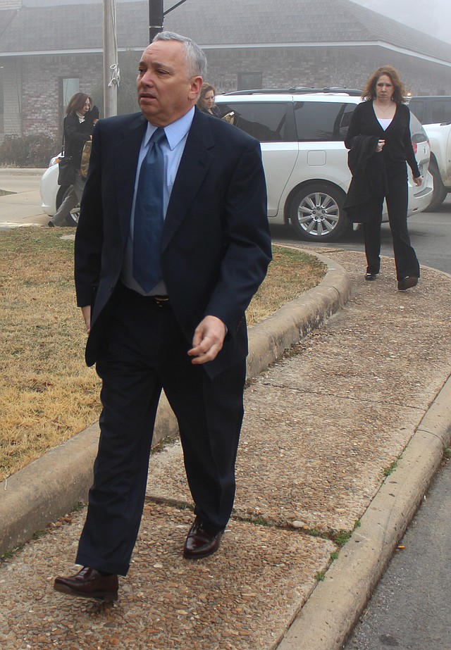 Arkansas Democrat-Gazette/GAVIN LESNICK - 03/10/2014 - Former University of Central Arkansas Chief of Staff Jack Gillean arrives at Van Buren Circuit Court in Clinton Monday before the first day of testimony in his trial.