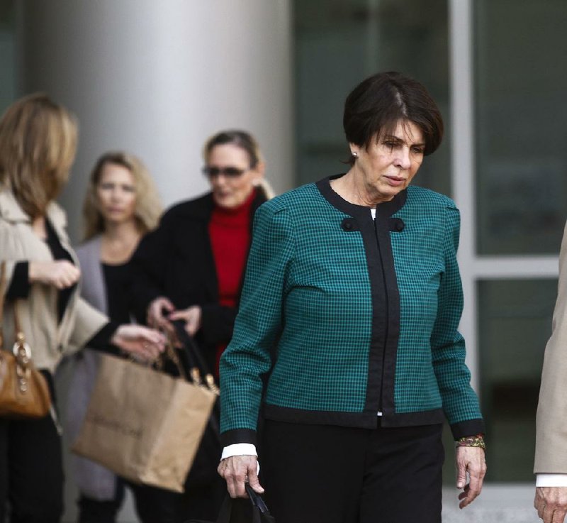 Former state Treasurer Martha Shoffner leaves the federal courthouse in Little Rock on Tuesday, March 11, 2014, after being found guilty of extortion and bribery charges. She declined to comment after the verdict. 