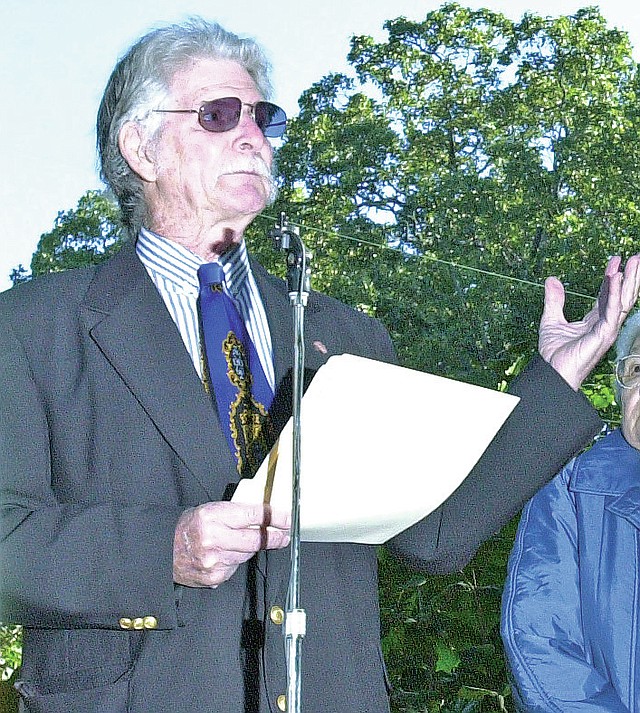 FILE PHOTO Lyell Thompson speaks at a peace pole dedication in 2003 under a patch of post oak trees at Wilson Park in Fayetteville.