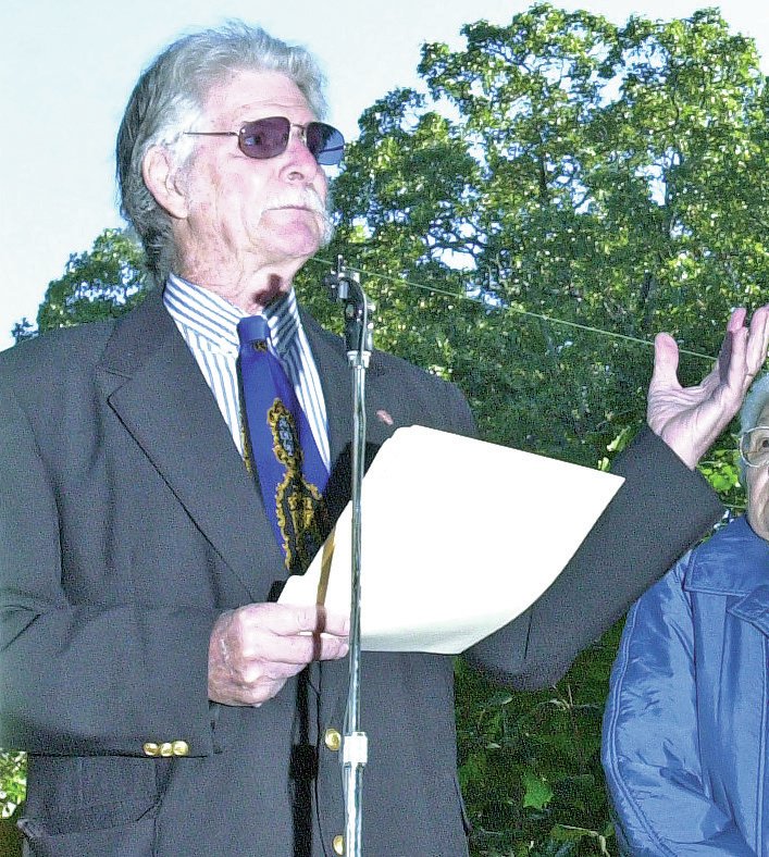 FILE PHOTO Lyell Thompson speaks at a peace pole dedication in 2003 under a patch of post oak trees at Wilson Park in Fayetteville.
