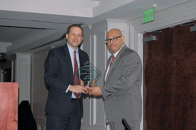 Lewis Shepherd, right, vice president for student and external affairs at Henderson State University, receives the President’s Award as Citizen of the Year from Eric Hughes, 2013 president of the Arkadelphia Chamber of Commerce, during the chamber’s annual meeting on March 6. Shepherd is co-chairman of the Clark County Strategic Plan Committee.