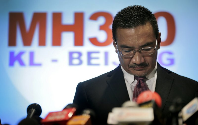 Malaysia's Minister of Transport Hishamuddin Hussein pauses before responding to queries from the media about the missing Malaysia Airlines jetliner MH370 on Thursday, March 13, 2014, in Sepang, Malaysia. 