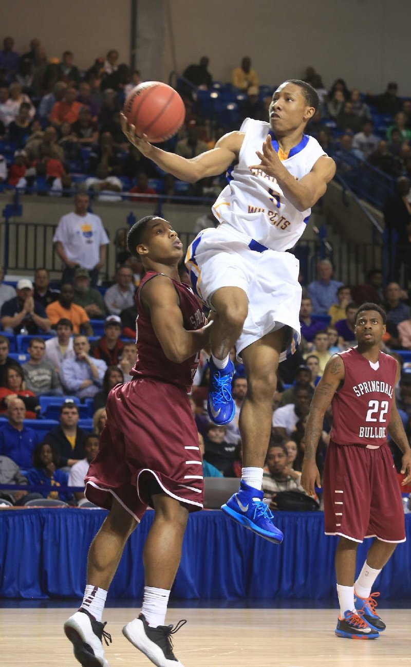 Arkansas Democrat-Gazette/RICK MCFARLAND --03/13/14--  North Little Rock's Kevaughn Allen (5) drives on Springdale in the State Class 7A Boys Championship game in Hot Springs Thursday.