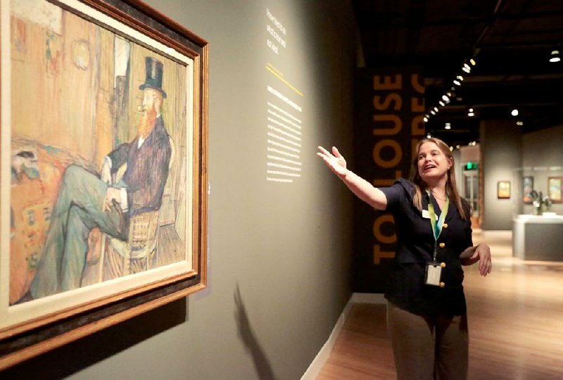 Crystal Bridges Museum of American Art assistant curator Manuela Well-Off-Man describes Henri de Toulouse-Lautrec’s 1897 M. de Lauradour during a media preview Thursday for “The William S. Paley Collection: A Taste for Modernism.” The temporary exhibit of 62 works by such artists as Picasso, Gauguin and Matisse opens Saturday at the Bentonville museum.