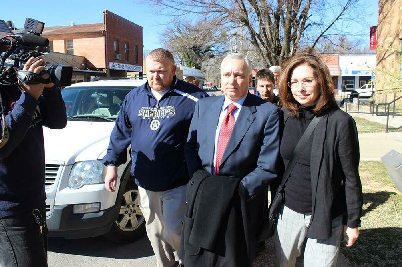 Former University of Central Arkansas Chief of Staff Jack Gillean (center) leaves court Wednesday in Clinton after being convicted on six counts of commercial burglary in a campus test-stealing scandal. 
