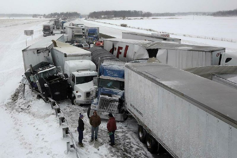 A multivehicle accident in the eastbound lane of the Ohio Turnpike ties up traffic Wednesday near Clyde, Ohio, as another round of snow and ice hit the Midwest and Northeast. 