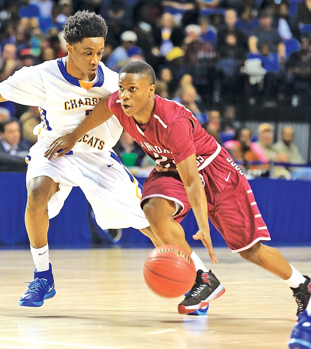 Arkansas Democrat-Gazette RICK MCFARLAND Treyshawn Lackey-Gause of Springdale High drives past North Little Rock&#8217;s Jawan Eldridge on Thursday at the state Class 7A boys championship game in Hot Springs.