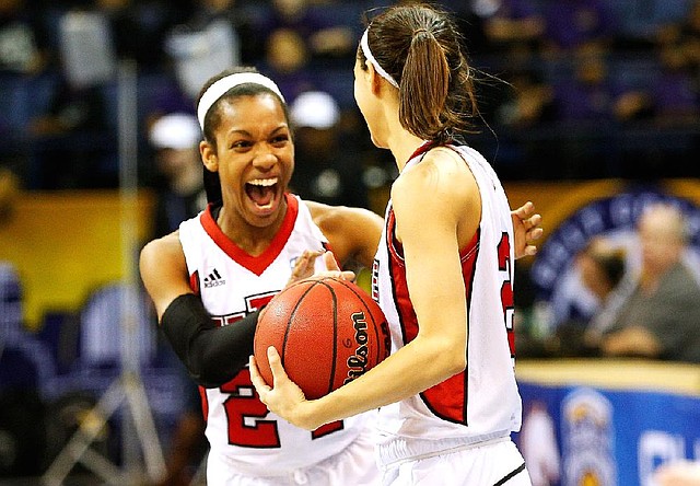 Arkansas State’s Aundrea Gamble (left) celebrates with Hanna Qedan after Friday’s victory over Texas State to earn a spot in today’s championship game of the Sun Belt Conference Tournament. 