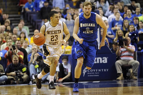 Wichita State's Fred VanVleet (23) drives past Indiana State's Jake Kitchell (0) in an NCAA college basketball game in the championship of the Missouri Valley Conference men's tournament, Sunday, March 9, 2014, in St. Louis. (AP Photo/Bill Boyce)