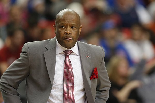 Arkansas head coach Mike Anderson watches play against the South Carolina during the first half of an NCAA college basketball game in the second round of the Southeastern Conference men's tournament, Thursday, March 13, 2014, in Atlanta. (AP Photo/John Bazemore)