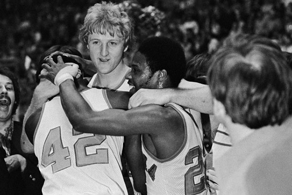 Indiana State star Larry Bird, center facing camera, embraces teammates Alex Gilbert, left, and Carl Nicks after the Sycamores beat Arkansas, 73-71, for the NCAA Midwest Regional crown on March 19, 1979, in Cincinnati. (AP Photo/File)