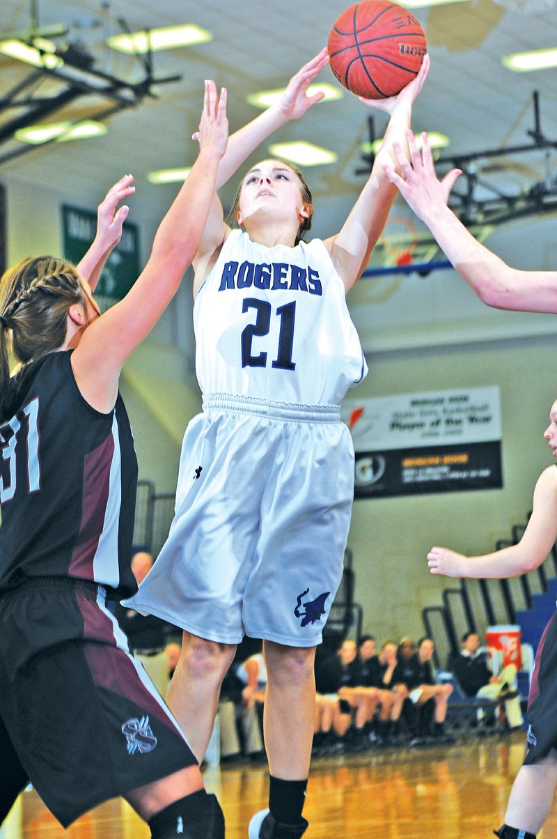 File PHOTO SAMANTHA BAKER • @NWASAMANTHA Libby Ganoung of Rogers High shoots Feb. 11 during a game against Siloam Springs in Rogers.