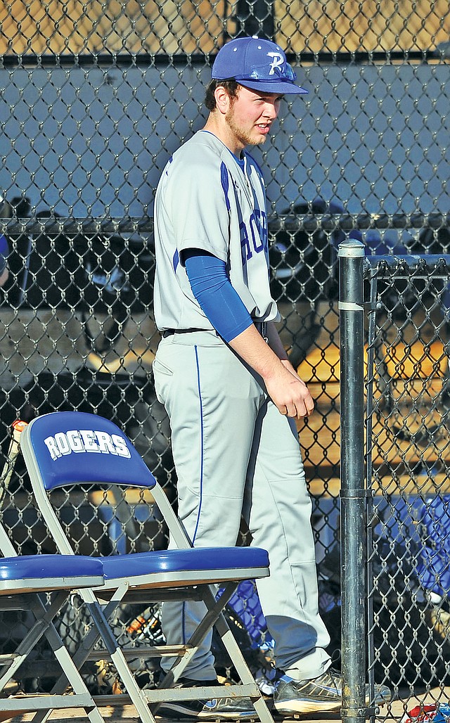 Staff Photo Michael Woods • @NWAMICHAELW Jacob Bray, Rogers High baseball player, watches his team Wednesday versus Alma at Veterans Park in Rogers.