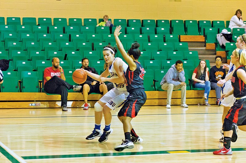 Courtesy Photo Morgan Ankrom of John Brown University drives March 6 against Mid-America Christian (Okla.).