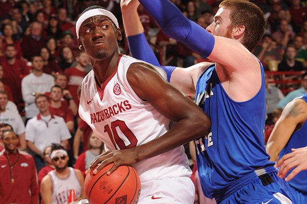 Arkansas forward Bobby Portis, left, makes a move to the basket as Indiana State forward Justin Gant defends during the second half Tuesday, March 18, 2014, at Bud Walton Arena in Fayetteville.