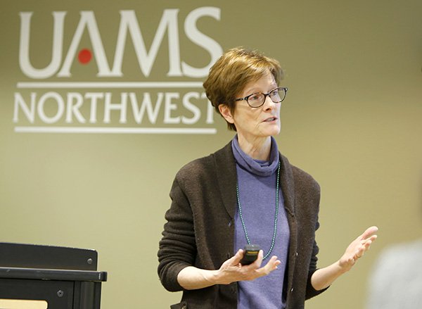 NWA Media/DAVID GOTTSCHALK 
Kate Stewart, a faculty member in the College of Public Health at University of Arkansas for Medical Sciences, speaks Monday at the Community Health Workers in Arkansas Northwest Arkansas regional meeting at UAMS-Northwest in Fayetteville. UAMS sponsored the meeting, which included a discussion about forming an association for community health workers.