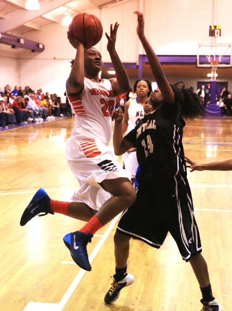 Little Rock Hall’s Princess Cole (left) shoots over Little Rock Central’s Chloe Washington for two of her 16 points Tuesday night in the All-Metro girls game. 