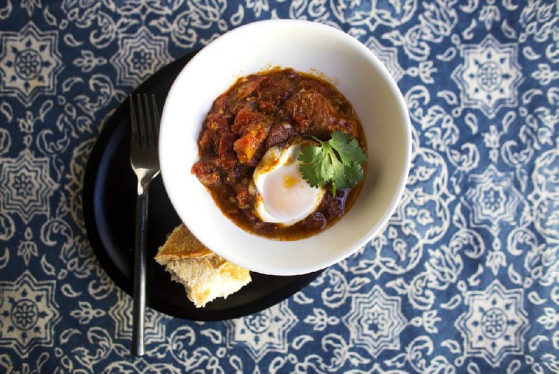 Moroccan Merguez Ragout With Poached Eggs is rich and flavorful. 