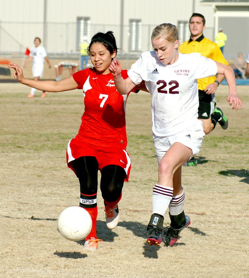 Photo by Randy Moll Amber Ellis, Gentry freshman, moves the ball into range for a goal in play against Dardanelle on Friday. Ellis kicked in five goals in the 7-0 victory for the Lady Pioneers soccer team. For more sports news and photos, see page 1B.