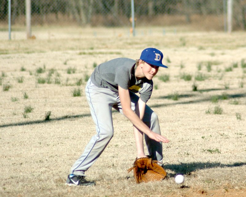 Photo by Mike Eckels Decatur freshman Bracey Owens lines up for a ground ball during practice March 13 at Edmiston Park.