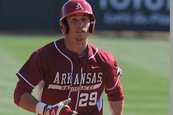 Arkansas first baseman Eric Fisher heads to third during the first inning against Grambling State Wednesday, March 19, 2014, at Baum Stadium in Fayetteville.