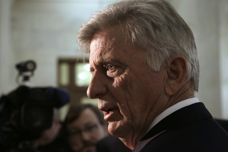 FILE — Arkansas Gov. Mike Beebe answers reporters questions in a hallway at the Arkansas state Capitol in Little Rock on March 12, 2014. 