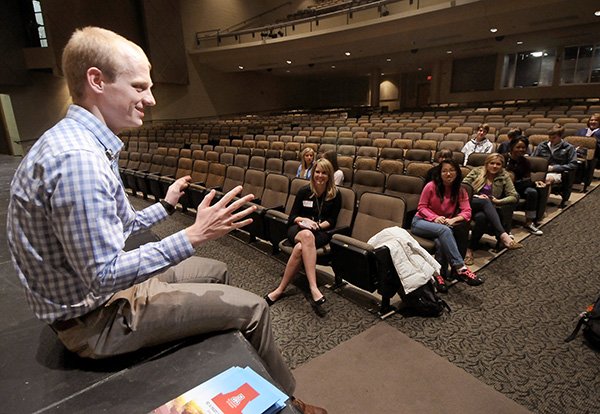 NWA Media/BEN GOFF 
Griffin Sorenson, a planning analyst with Wal-Mart Stores Inc., speaks to members of the Bentonville High School DECA Club about ethics and leadership Tuesday inside Arend Arts Center at Bentonville High School. Sorenson and fellow members of the University of Arizona Alumni Association’s local chapter have been working with DECA Club members to help them learn more about Wal-Mart and its suppliers.