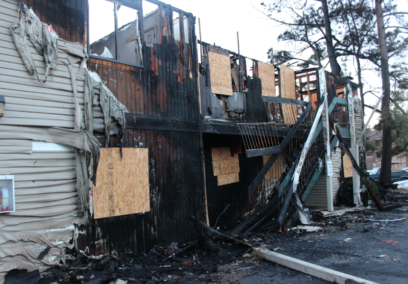 Fire damage is seen Thursday morning, March 20, 2014, at the Normandy Place Apartments at 7111 Indiana Ave. in Little Rock.