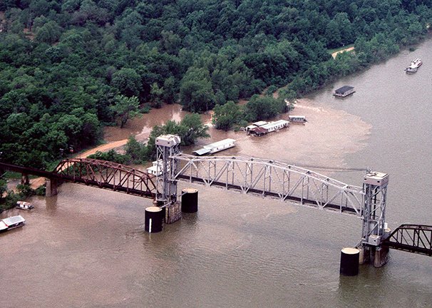 An aerial view of the White River, the Benzal bridge and the shantyboat town during high water in 1998. The same view today would show nothing but the river and a skeleton of the old railroad bridge.