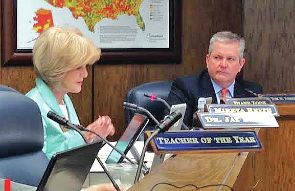 JOHN LYON ARKANSAS NEWS BUREAU Diane Zook, left, State Board of Education member from Melbourne, asks a question during a board meeting Thursday as Tom Kimbrell, state Education Commissioner, looks on.