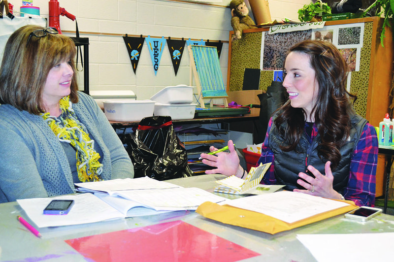 Tracy Roberts, left, and Leigh Ann Veach discuss plans for the 2014 Relay for Life for Pope and Yell counties. The relay will be held April 25-26 at the Pope County Fairgrounds in Russellville.