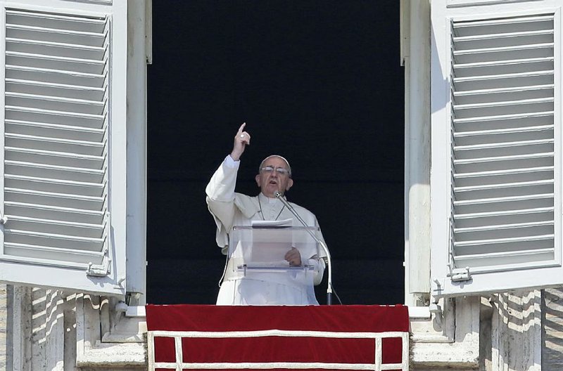 Pope Francis delivers his message on the occasion of the Angelus noon prayer in St. Peter's Square, at the Vatican, Sunday, March 16, 2014.
