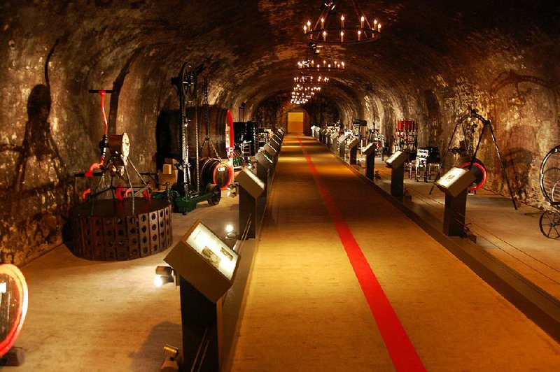 Tunnels with old-time winemaking and bottling equipment are featured on the Mumm Champagne cellar tour. 