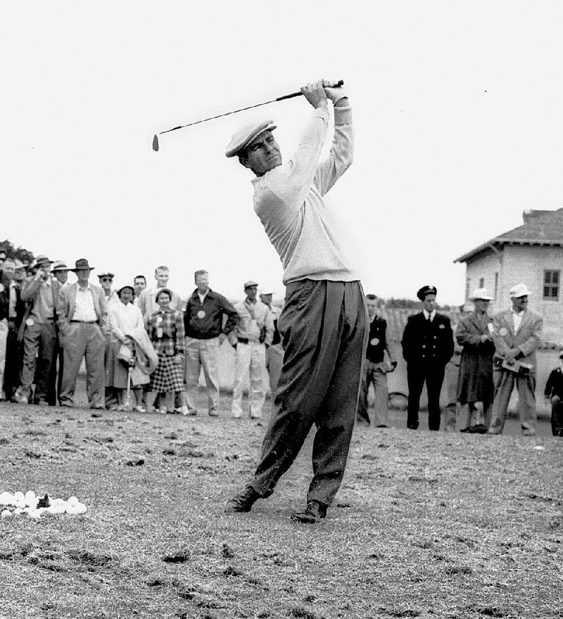 FILE-This June 17, 1955 file photo shows Jack Fleck, of Davenport, Iowa, warming up  before a playoff with Ben Hogan for the National Open title. The Olympic Club gained a reputation as the "graveyard of champions" for the major champions who finish second. And the 1955 U.S. Open is best known for how unheralded Fleck took down Ben Hogan in one of golf's great upsets.  (AP Photo/File)