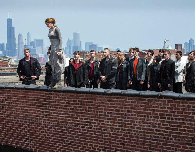 Surrounded by her fellow recruits, Tris (Shailene Woodley) prepares to leap into the unknown as part of her “Dauntless” training in Divergent. 
