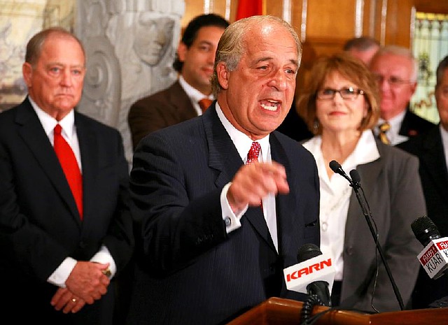 Construction of the $1.1 billion steel mill near Osceola is still on hold, John Correnti (center, speaking), chief executive officer of Big River Steel, said Thursday.