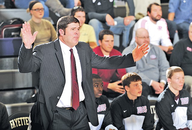  FILE PHOTO ANDY SHUPE Brad Stamps, Springdale coach, directs his team against Fayetteville during the first half on Jan. 24 at Fayetteville.