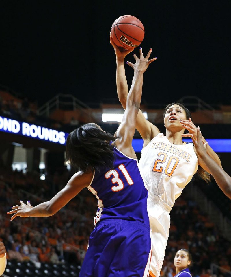 Tennessee center Isabelle Harrison (right) shoots over Northwestern (La.) State forward Trudy Armstead in the first half of the Lady Volunteers’ 70-46 victory Saturday in Knoxville, Tenn. 
