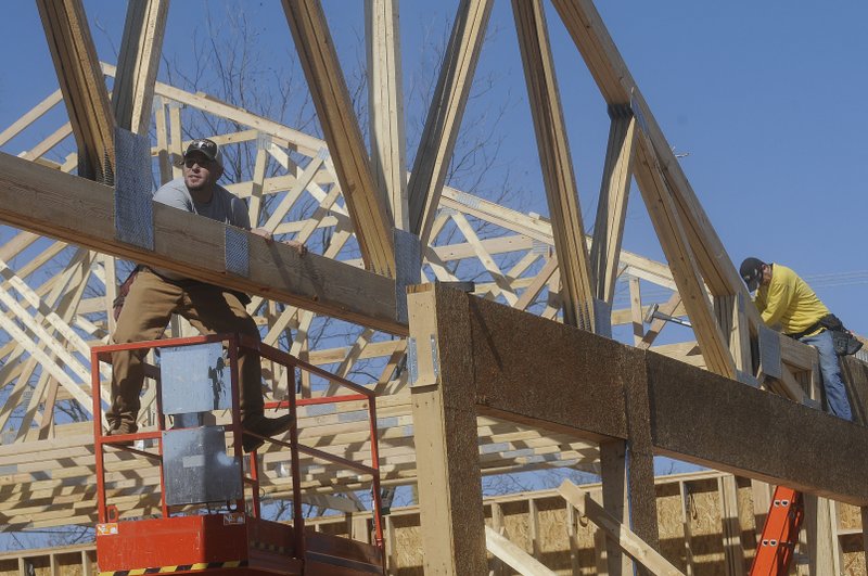 Note: Millar and Jordon are correct. FILE PHOTO &#8212; Jeff Millar, left, and Jason Jordon, both of Springdale, set trusses in place on last year at the Casey&#8217;s General Store being built at Second and Locust streets in Rogers. Casey&#8217;s has opened 17 locations in the two-county area in just a couple of years.