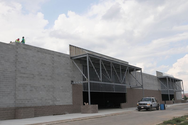 FILE PHOTO &#8212; The Scottsdale Center in Rogers was expanded in 2012 at Walnut and Promenade Boulevard. Developers say the pace of commercial is picking up in the region with location still the biggest draw.