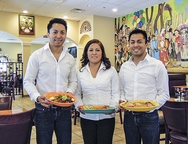 Gabriela Gonzalez (center) owns and operates her namesake restaurant with her three sons Rene (left), Yovany (right) and Diego, and their long-time friend and manager, Arnulto Navarro.