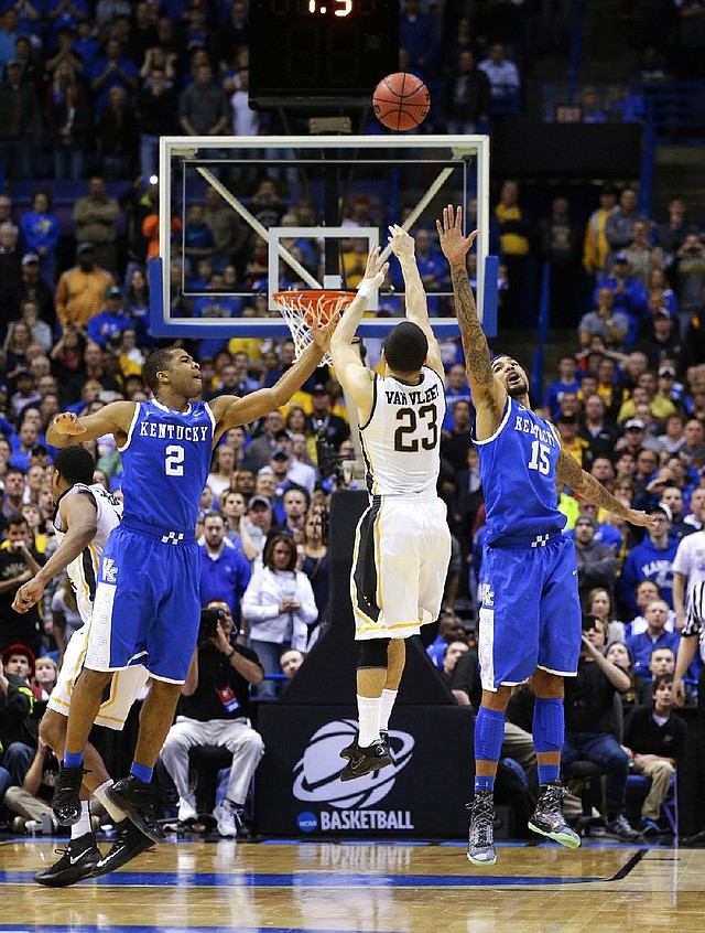The potential game-winning shot by Wichita State Shockers guard Fred VanVleet (23) was off the mark as he was defended by Kentucky Wildcats guard Aaron Harrison (2) and Willie Cauley-Stein during the third round of the NCAA Tournament in St. Louis on Sunday, March 23, 2014. The Kentucky Wildcats defeated the Wichita State Shockers, 78-76. (Mark Cornelison/Lexington Herald-Leader/MCT)