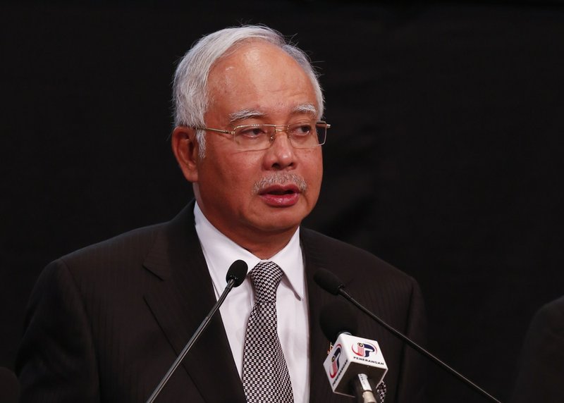 Malaysian Prime Minister Najib Razak speaks about the missing Malaysia Airline, MH370 at Putra World Trade Centre in Kuala Lumpur, Malaysia, on Monday, March 24, 2014. Razak says new data show missing plane plunged into southern Indian Ocean. 